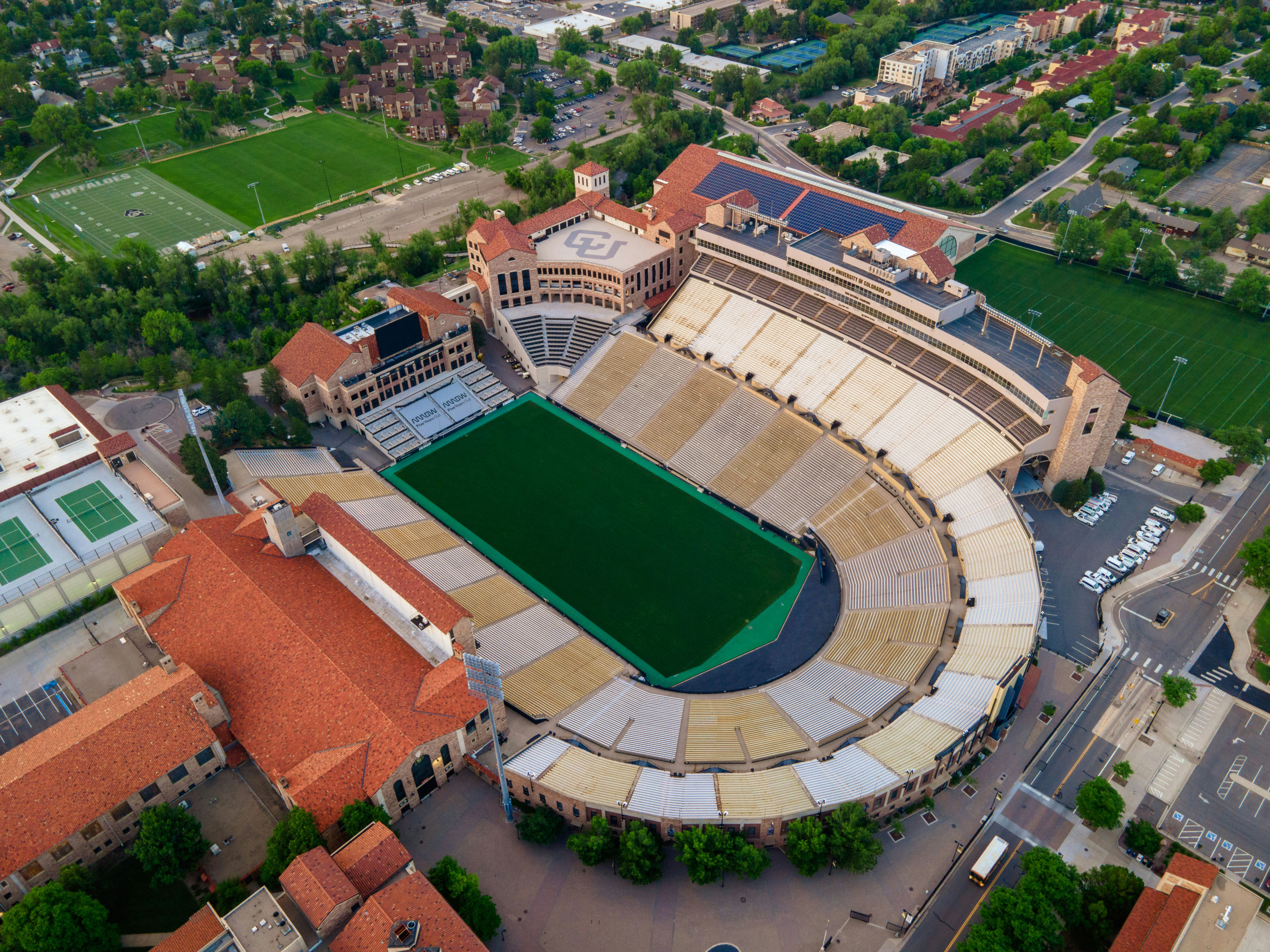 Aerial view of a college football stadium surrounded by campus buildings