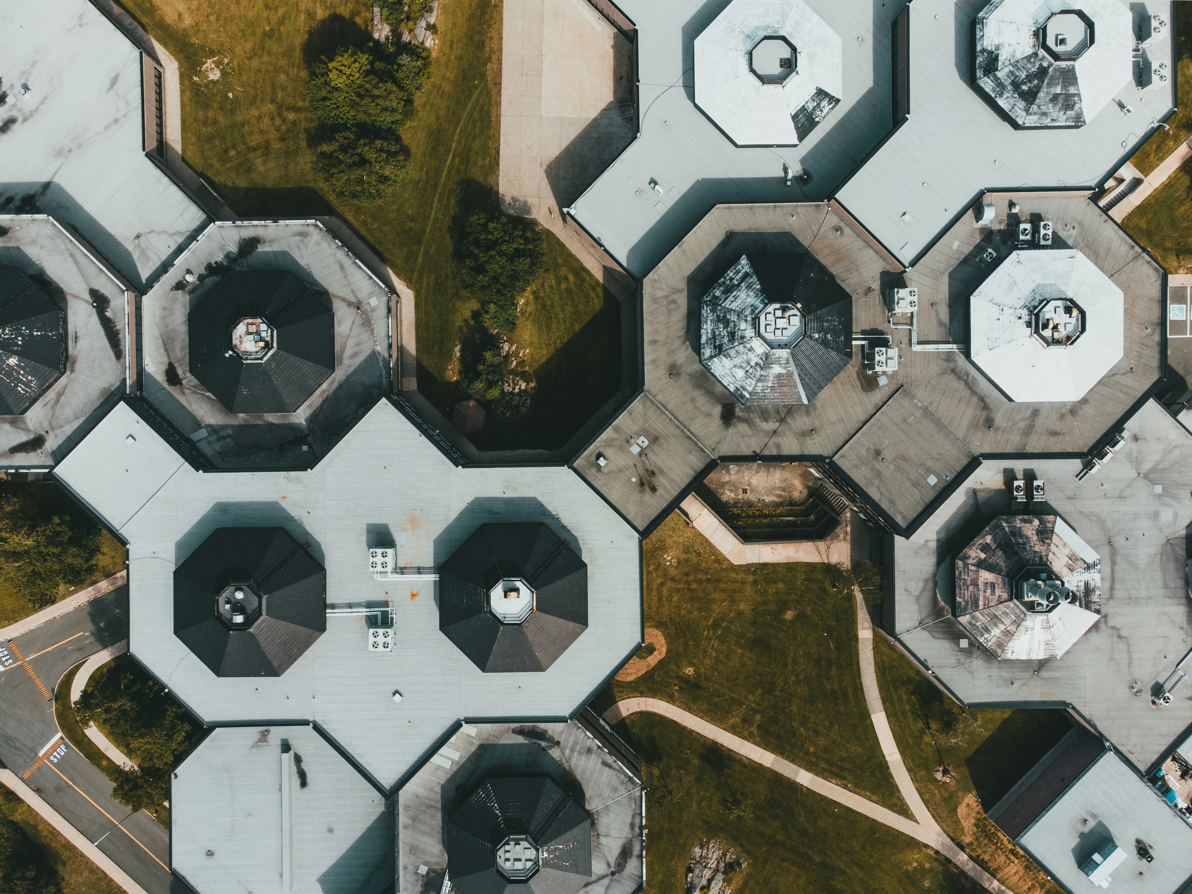 Aerial view of facility building rooftops arranged in a hexagonal pattern