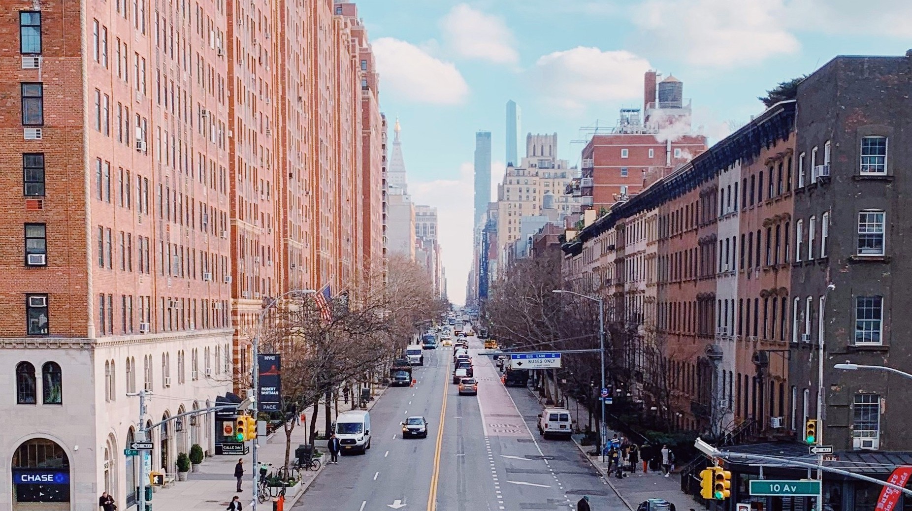 Elevated view of a busy city avenue lined with brick buildings